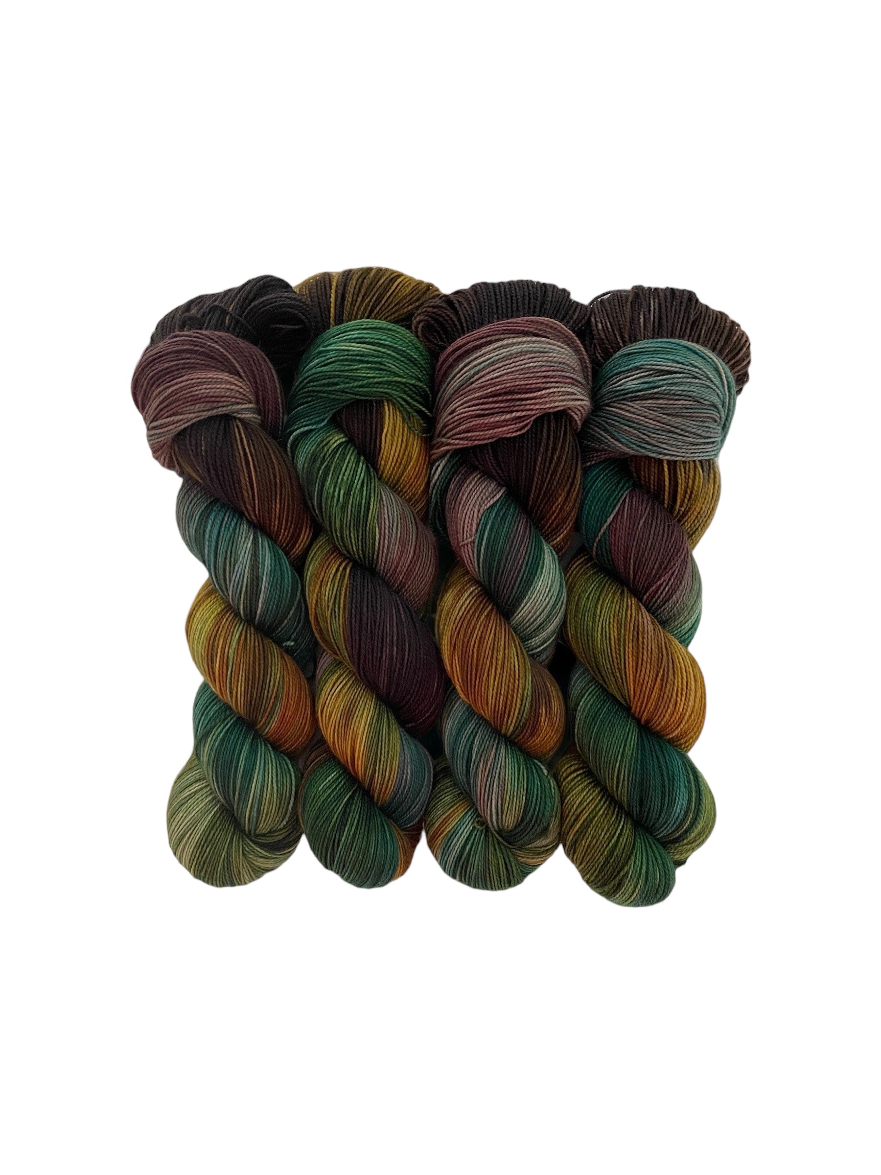 HIDDEN FOREST yarn is made from 80% Superwash British Blue Faced Leicester wool for a soft, luxurious feel. The addition of 20% nylon adds durability and strength, making it perfect for socks and other projects. Available in a 100g skein in a beautiful palette of gold, green, brown and teal