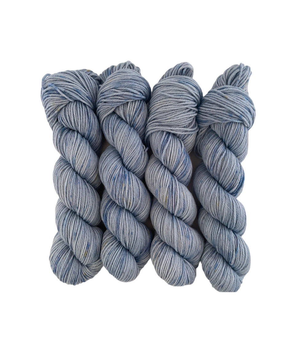 Introducing RAIN DANCE, the ultimate blend of style and sustainability. Made from 100% organic merino wool, our hand-dyed base of blues offers a luxurious and eco-friendly choice for your wardrobe. 