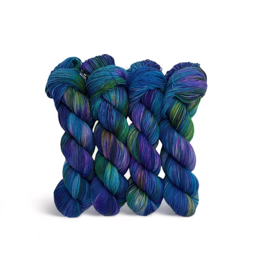 MAKE BELIEVE yarn is made from 80% Superwash British Blue Faced Leicester wool for a soft, luxurious feel. The addition of 20% nylon adds durability and strength, making it perfect for socks and other projects. Available in a 100g skein in a beautiful palette of blue, turquose, green, and purple.