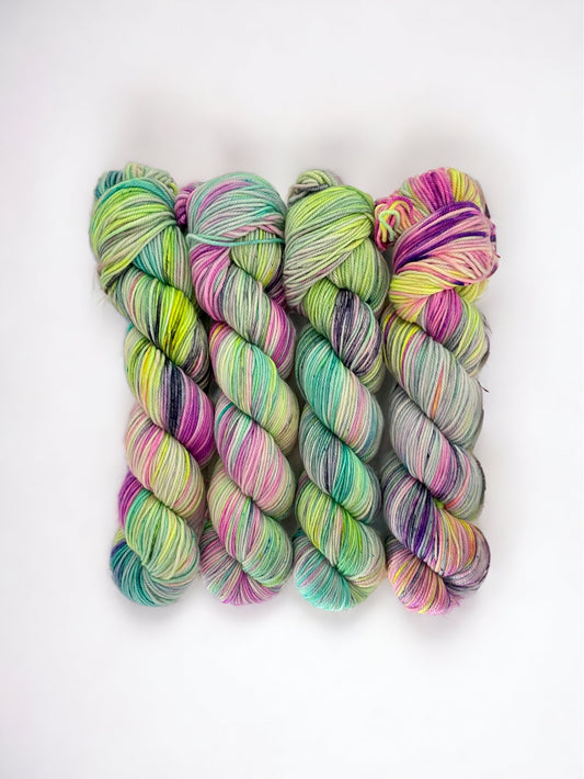 Experience the luxurious and vibrant colors of our DAY ONE hand-dyed super wash merino yarn. Made from high-quality merino wool, each skein is carefully hand-dyed for a one-of-a-kind look. Perfect for knitting or crocheting, this yarn is both soft and durable.