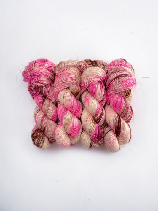 Made from 100% sustainable Merino wool, this fingering weight yarn is perfect for eco-conscious knitters looking for high-quality, unique yarn. Each 100g skein is carefully hand-dyed for a one-of-a-kind result.