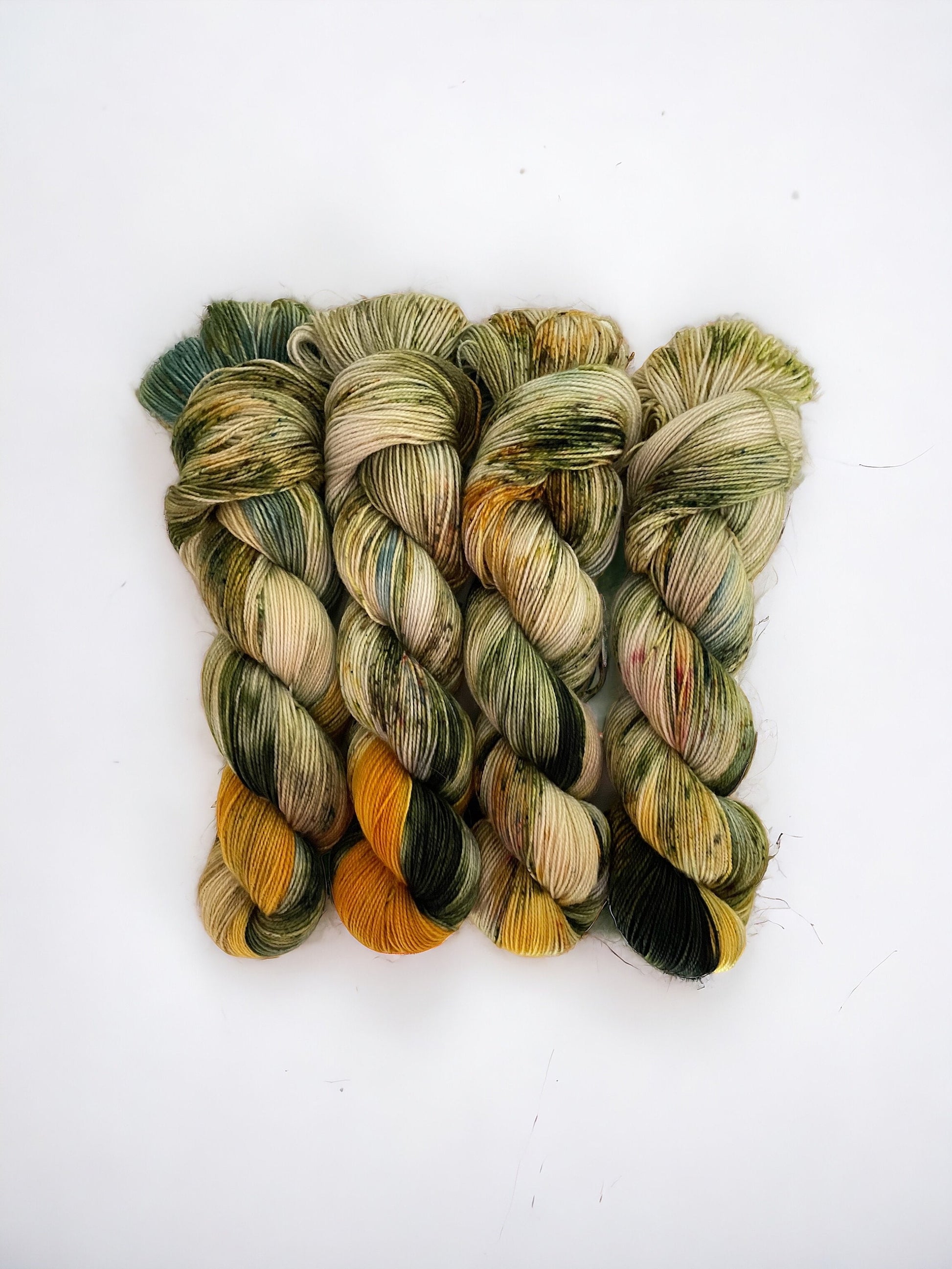 MUSTARD FIELD yarn is made with 80% Superwash Blue Faced Leicester wool and 20% Nylon. This fingering/sock weight yarn is perfect for creating strong, long-lasting projects with a soft and luxurious feel